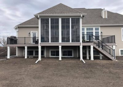 TimberTech Slight Grey Decking with Eze Breeze Porch Enclosure Windows and Westbury Railing