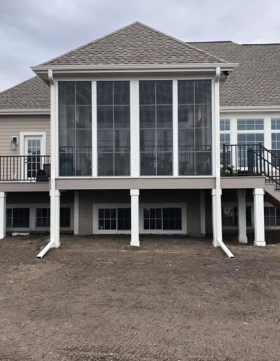TimberTech Slight Grey Decking with Eze Breeze Porch Enclosure Windows and Westbury Railing